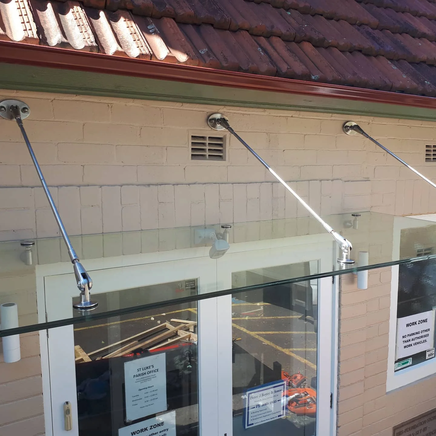Frameless glass awning